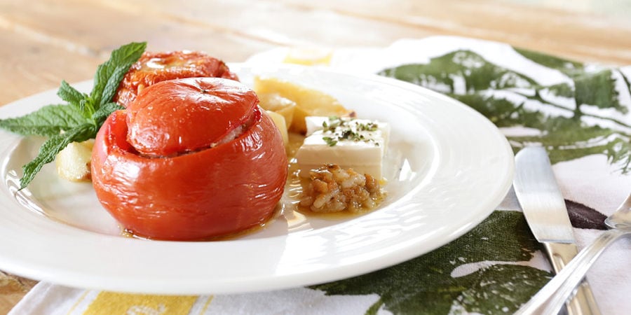 plate with cooked tomato stuffed with rice and fresh herb at 'Eleonas'